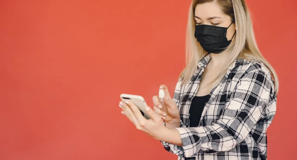 woman trying the Best Antimicrobial Spray for Phones